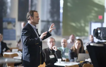 Person Speaking to Audience in Office